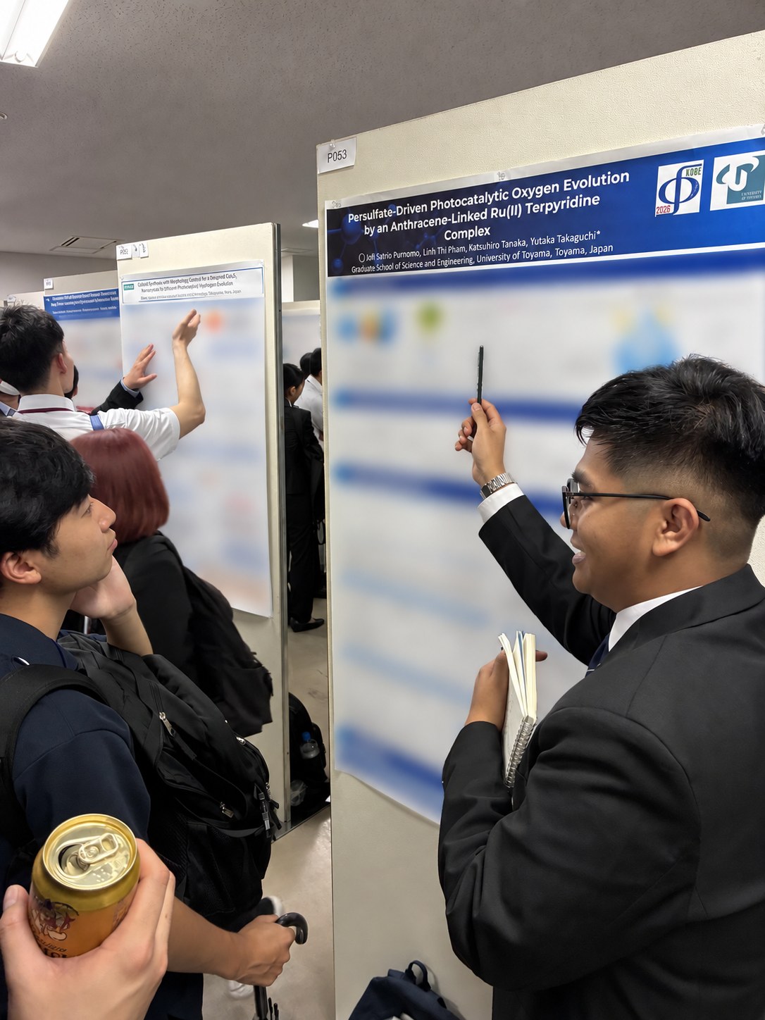 Jofi Satrio Purnomo discussing his research during the poster session.