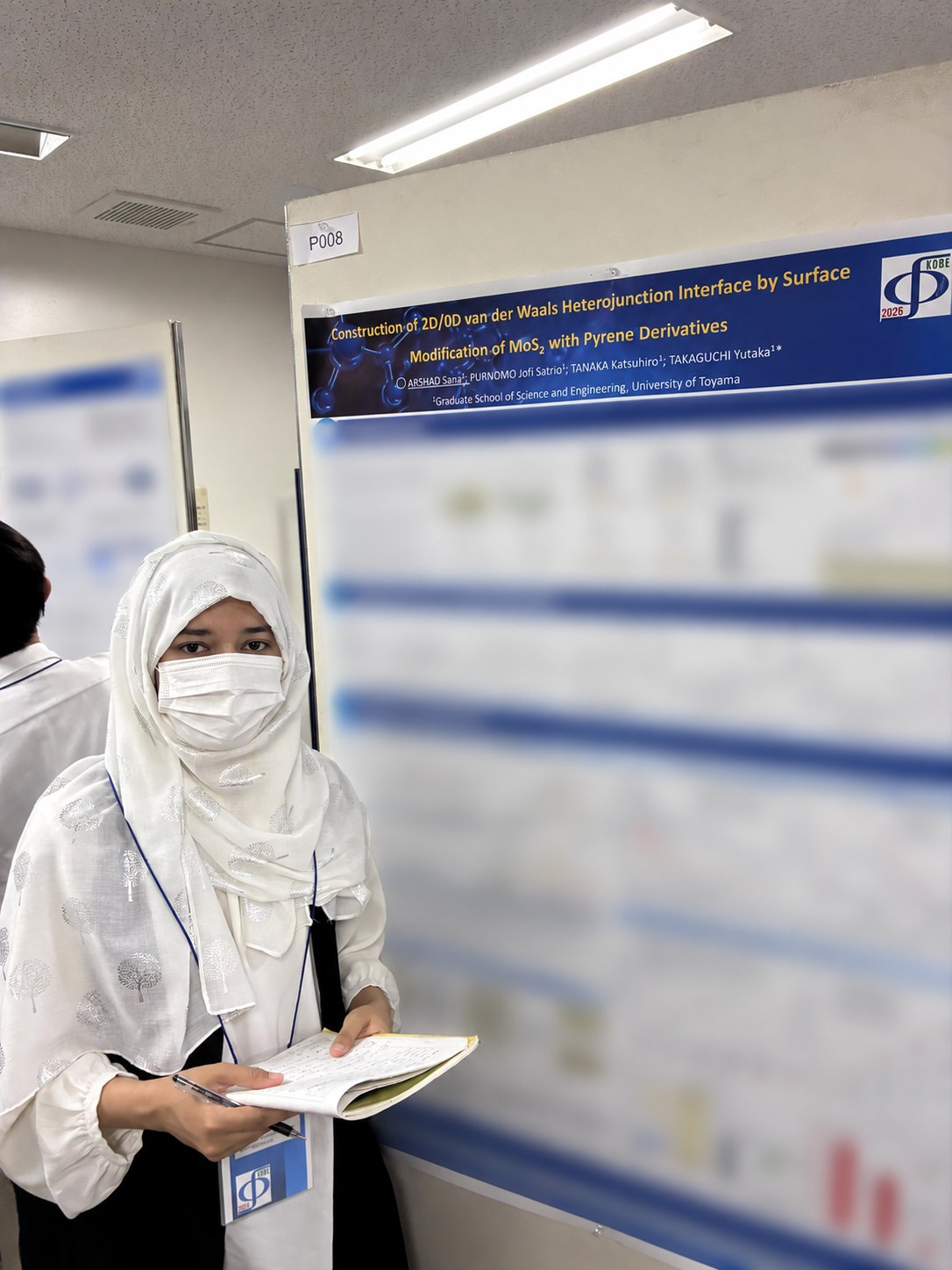 Sana Arshad with her poster at the 2026 Photochemistry Symposium.